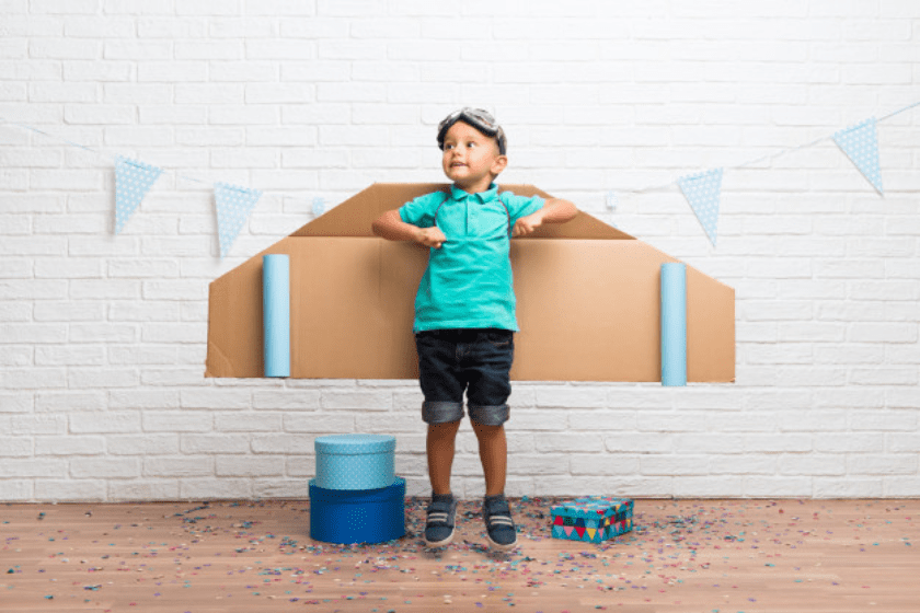niño jugando aviador