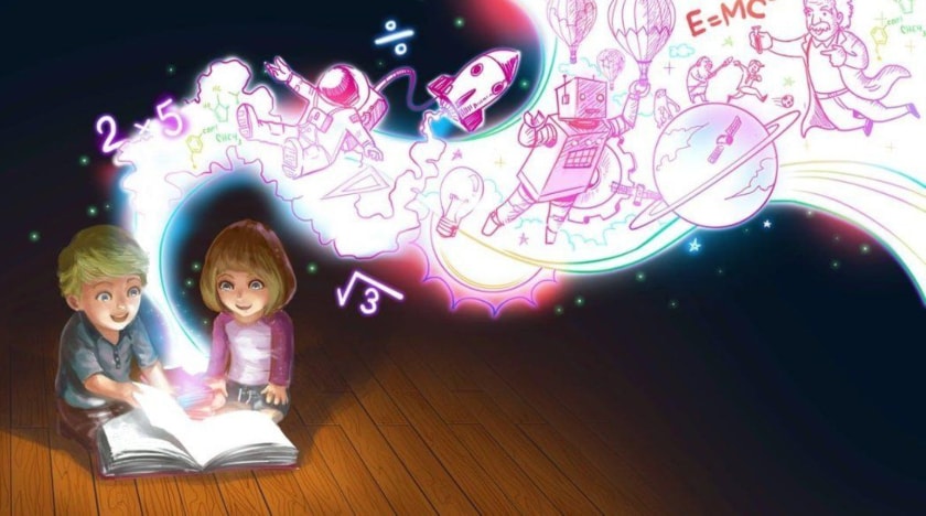 niña y niño leyendo libro
